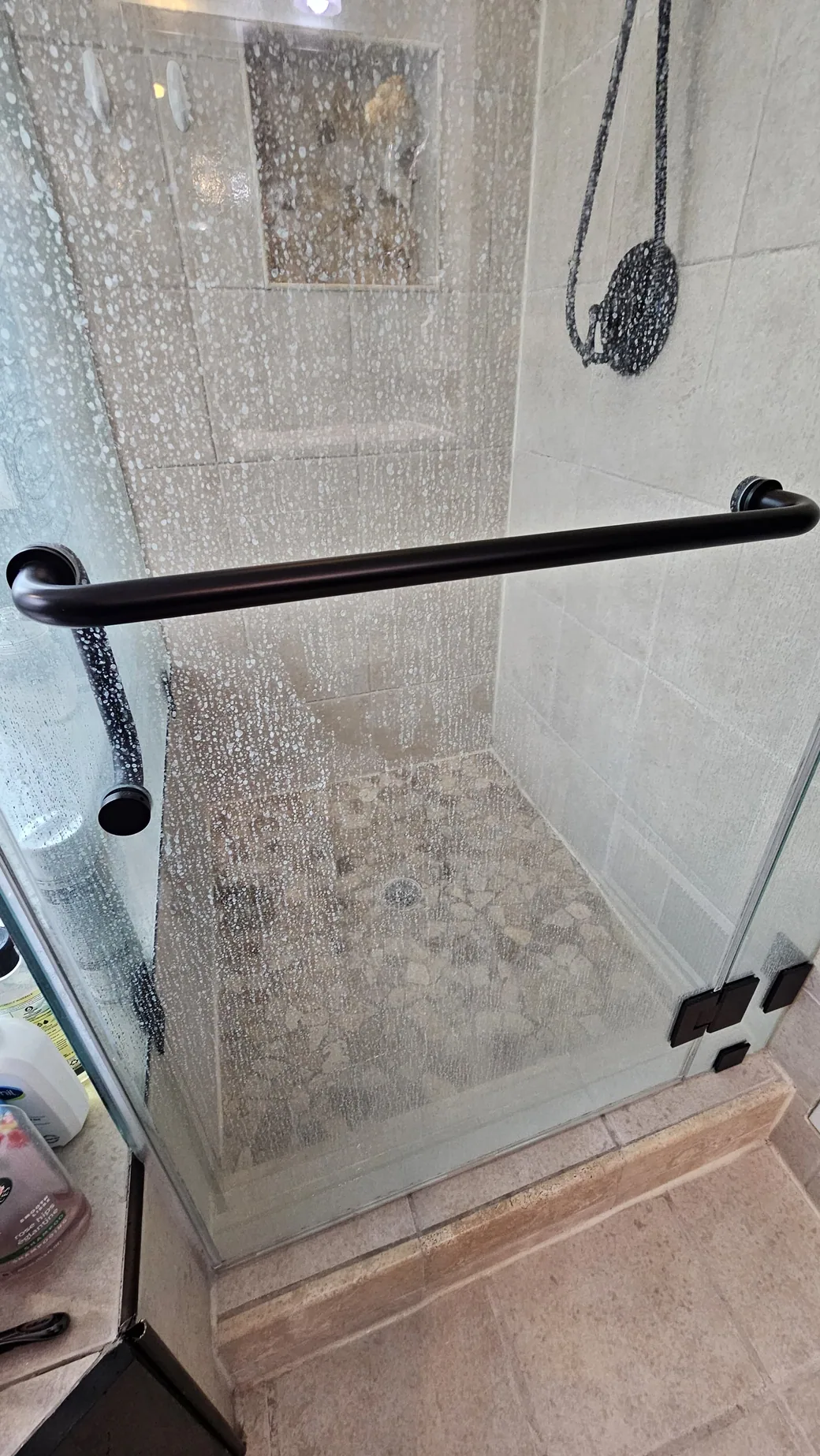 Glass shower cleaning with detailed treatment
