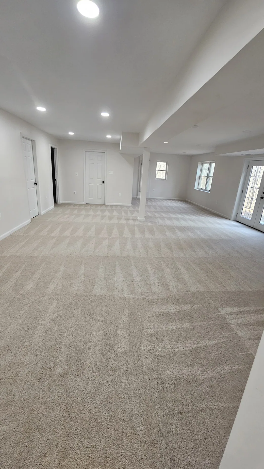 Finished carpeted room with clean lines