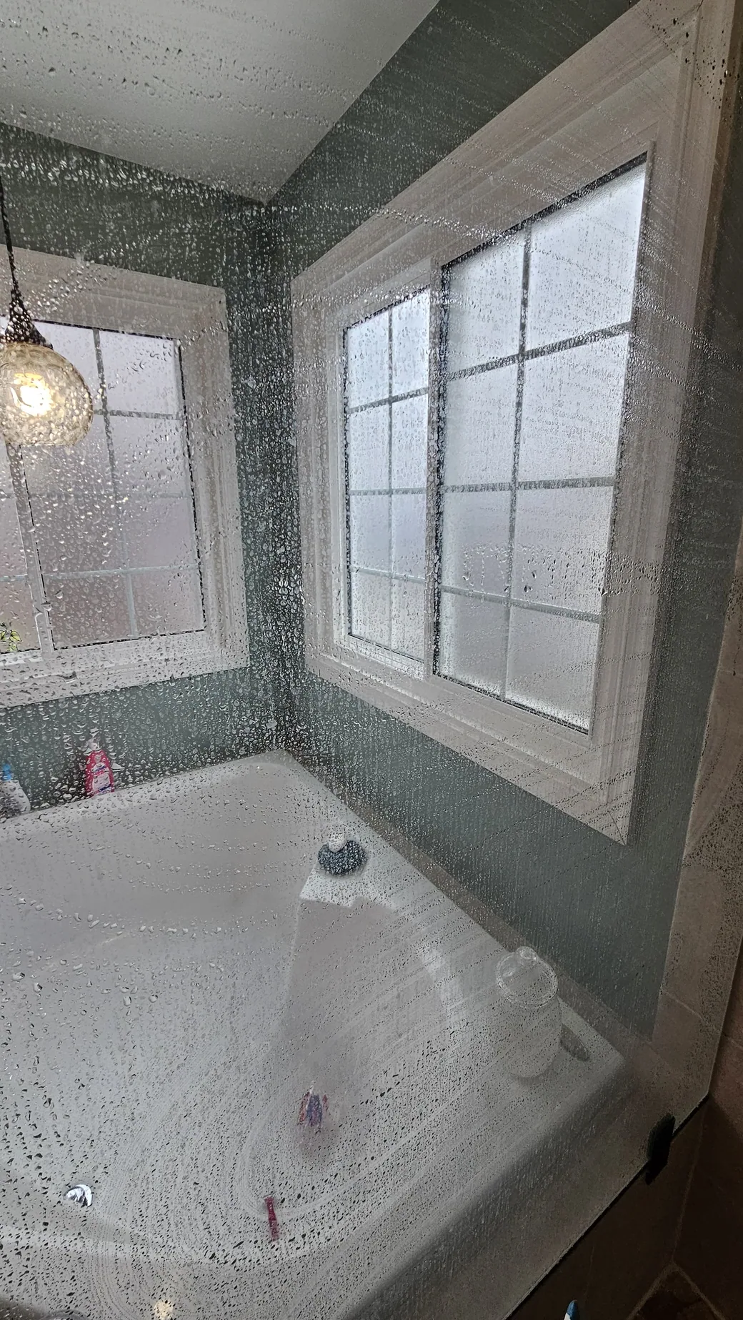 Bathroom glass during cleaning treatment